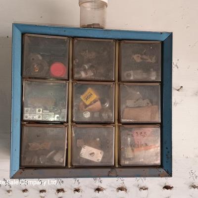 Two hardware organizers with some hardware