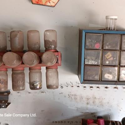 Two hardware organizers with some hardware