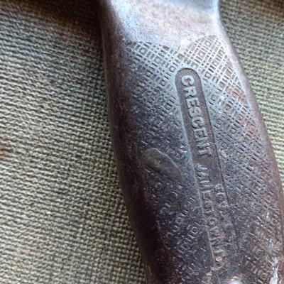 Assortment of tools - Bow saw- Hack saw - cloth measuring tape - hammer - and more