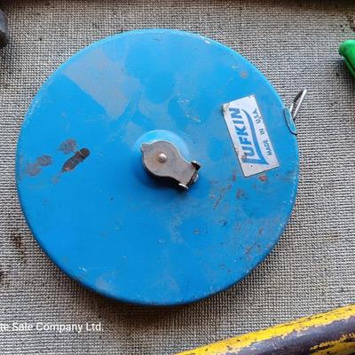 Assortment of tools - Bow saw- Hack saw - cloth measuring tape - hammer - and more