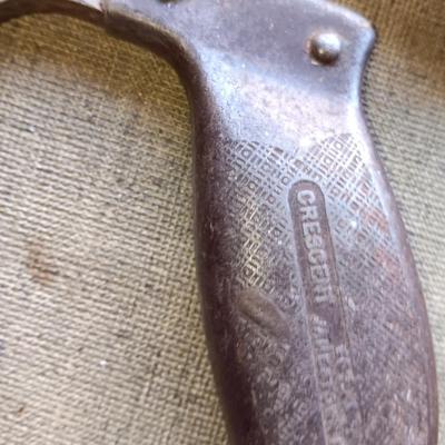 Assortment of tools - Bow saw- Hack saw - cloth measuring tape - hammer - and more