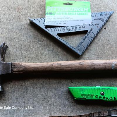 Assortment of tools - Bow saw- Hack saw - cloth measuring tape - hammer - and more