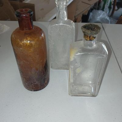 Three vintage bottles two small pocketknives and a new Tactical Frost cutlery Paratrooper Knife