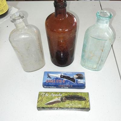 New pocketknives- "The Apache" and the " Eagle eye II" and three vintage bottles