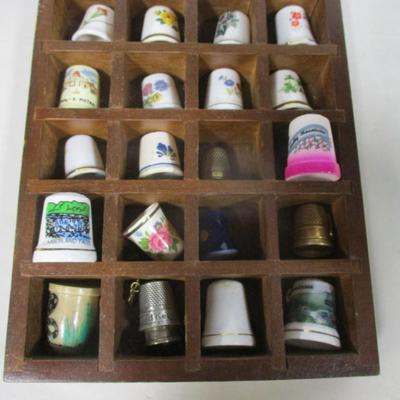 Collection Of Thimbles in Wooden Display Shelf