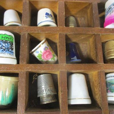 Collection Of Thimbles in Wooden Display Shelf