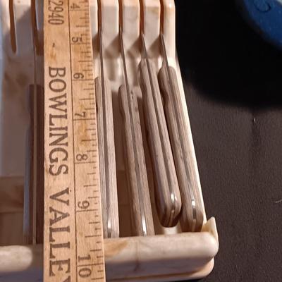 Blue enamelware dish with a set of vintage Zylco Freeze knives in a hanging bakelite case