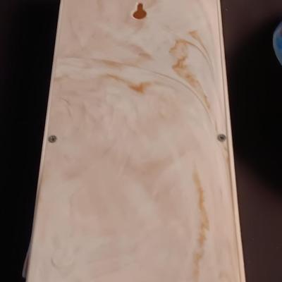 Blue enamelware dish with a set of vintage Zylco Freeze knives in a hanging bakelite case