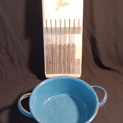 Blue enamelware dish with a set of vintage Zylco Freeze knives in a hanging bakelite case