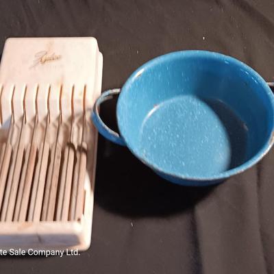 Blue enamelware dish with a set of vintage Zylco Freeze knives in a hanging bakelite case
