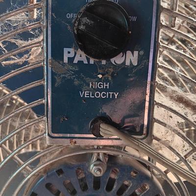 Two metal guard steel framed free standing electric fans