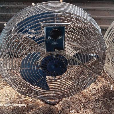 Two metal guard steel framed free standing electric fans