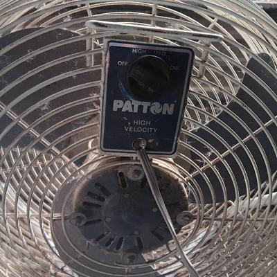 Two metal guard steel framed free standing electric fans
