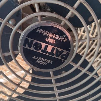 Two metal guard steel framed free standing electric fans