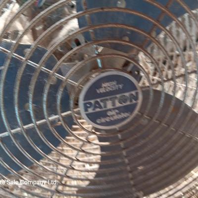 Two metal guard steel framed free standing electric fans