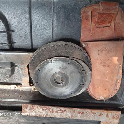 Black plastic toolbox with an assortment of tools