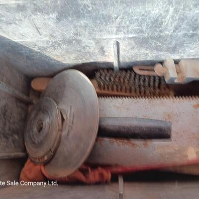 Black plastic toolbox with an assortment of tools