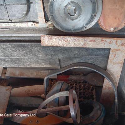 Black plastic toolbox with an assortment of tools