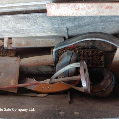 Black plastic toolbox with an assortment of tools