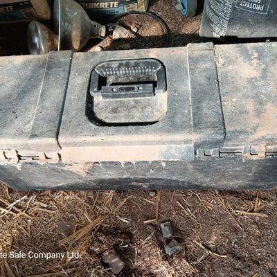 Black plastic toolbox with an assortment of tools