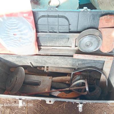 Black plastic toolbox with an assortment of tools