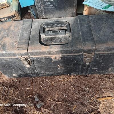 Black plastic toolbox with an assortment of tools