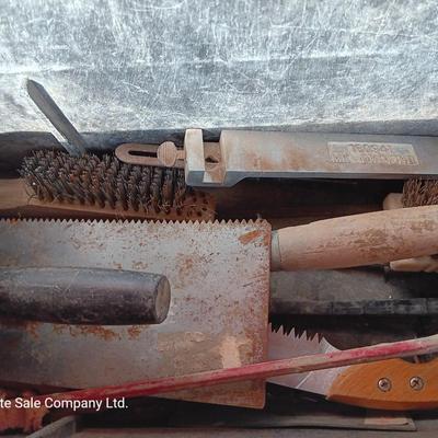 Black plastic toolbox with an assortment of tools