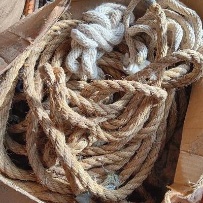 4 orange traffic cones and an assorment of different sized rope