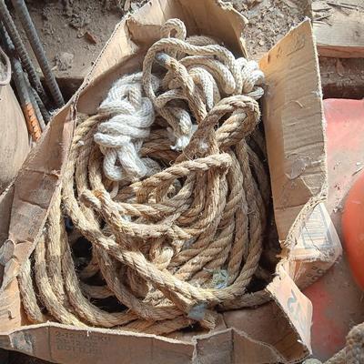 4 orange traffic cones and an assorment of different sized rope