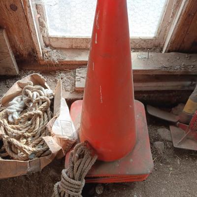 4 orange traffic cones and an assorment of different sized rope