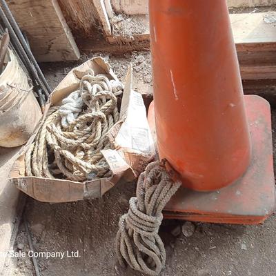4 orange traffic cones and an assorment of different sized rope