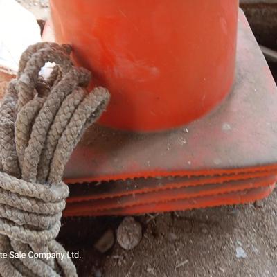 4 orange traffic cones and an assorment of different sized rope