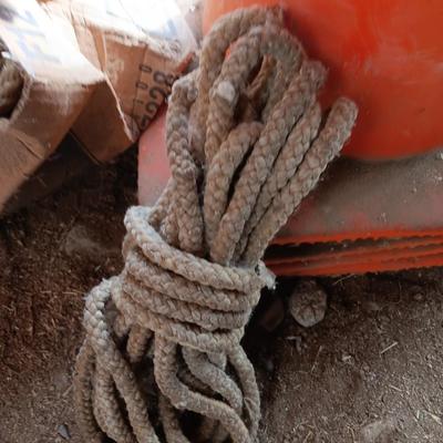 4 orange traffic cones and an assorment of different sized rope