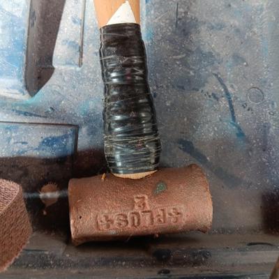 Blue plastic toolbox with an assortment of tools