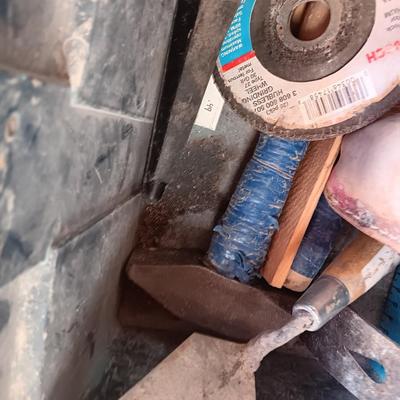Blue plastic toolbox with an assortment of tools