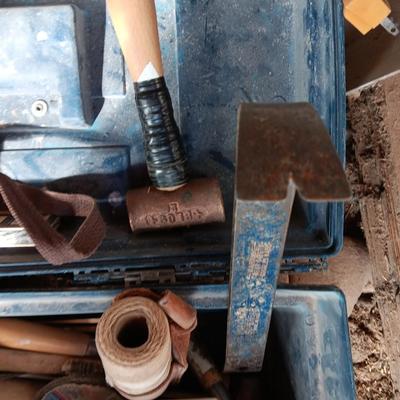 Blue plastic toolbox with an assortment of tools