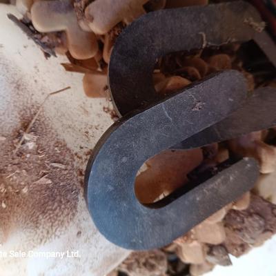 Box of dark colored tile with buckets of tile spacers and other hardware