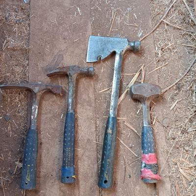 Four Ewing hand tools - hatchet - rock pick - sledgehammer - hammer