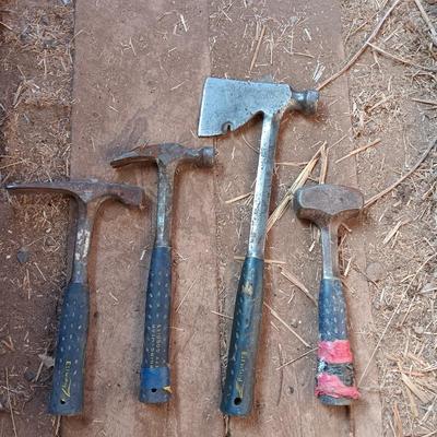 Four Ewing hand tools - hatchet - rock pick - sledgehammer - hammer