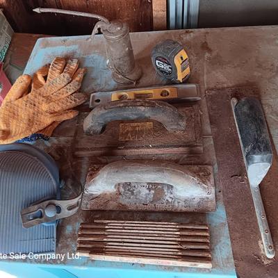 Assortment of tools - cement trowels - oil can - tape measure and more