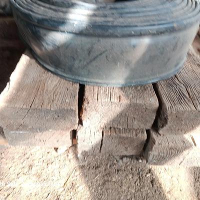 Six landscape timers and a roll of lawn and garden edging