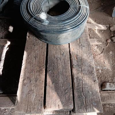 Six landscape timers and a roll of lawn and garden edging