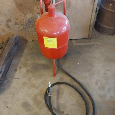 Pressurized sandblaster with hose and instructions