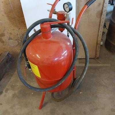 Pressurized sandblaster with hose and instructions