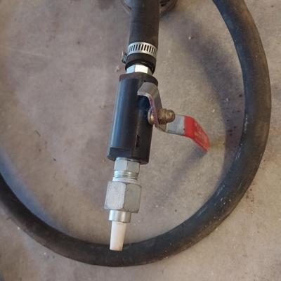 Pressurized sandblaster with hose and instructions