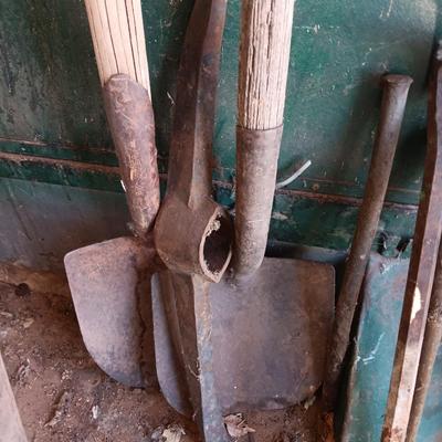 Antique tools - handmade post pounder - prybars - and an assortment of other steel tools