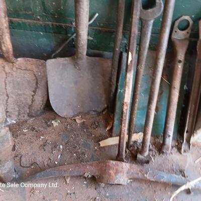 Antique tools - handmade post pounder - prybars - and an assortment of other steel tools