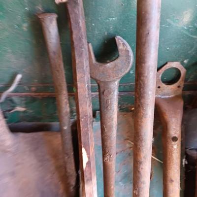 Antique tools - handmade post pounder - prybars - and an assortment of other steel tools