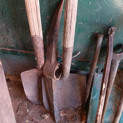 Antique tools - handmade post pounder - prybars - and an assortment of other steel tools