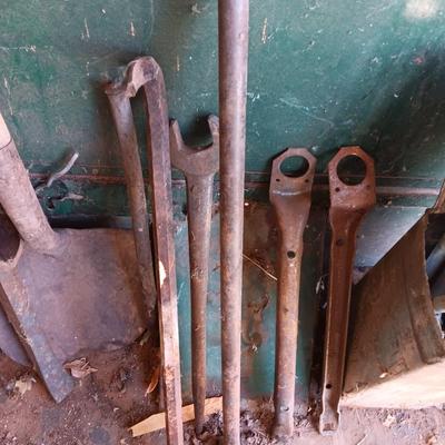 Antique tools - handmade post pounder - prybars - and an assortment of other steel tools